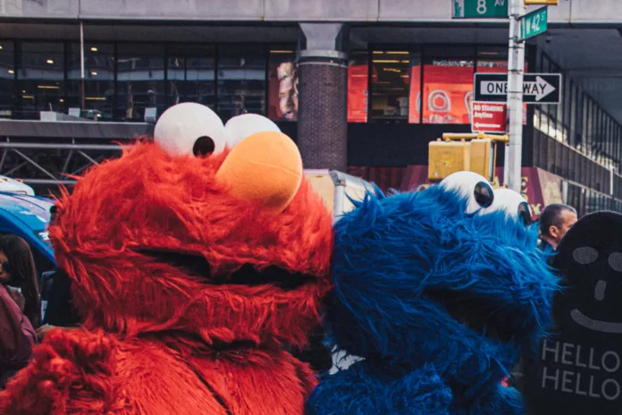 elmo and cookie monster mascots